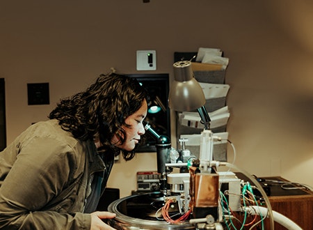 Jett Galindo operating a cutting lathe