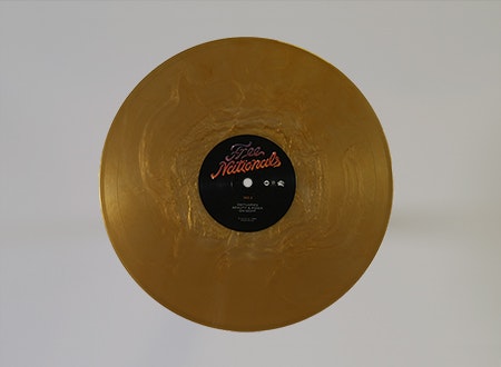Free Nationals gold-colored vinyl record