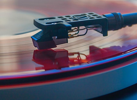 Closeup of a tonearm cartridge and stylus