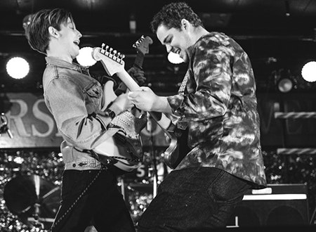 Band members of High Flyer performing live onstage.