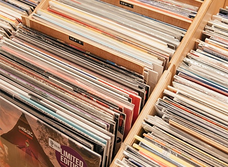 Crates of assorted 12 inch records on display at Tiny Record Shop.
