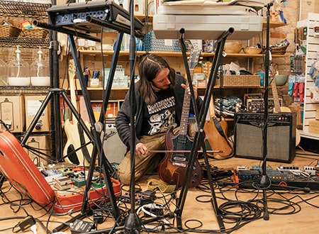 Musical equipment being set up for a live performance at Tiny Record Shop