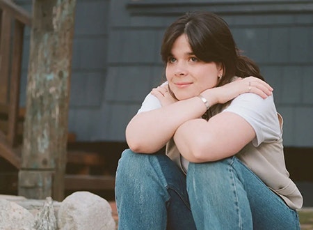 Leith Ross sitting with arms crossed