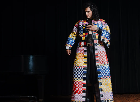Jeremy Dutcher modeling a quilted jacket.
