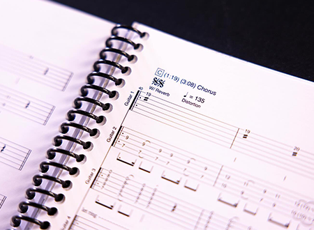 Open guitar tab book.