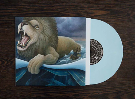 Light blue vinyl record in a sleeve featuring a lion illustration, part of the Protest the Hero 'Pacific Myth' vinyl box set.