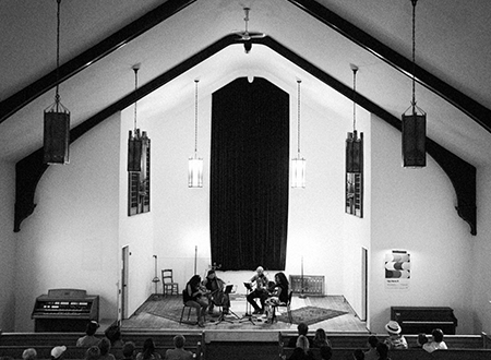odDh5jdN-UpHereMarc-Etienne-Mongrain-8.png Musicians performing onstage in a church.