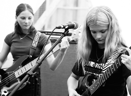 Members from Thunder Queens Performing onstage.