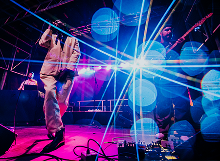 TOBi performing onstage.
