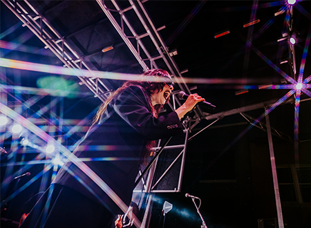 Allie X performing onstage.