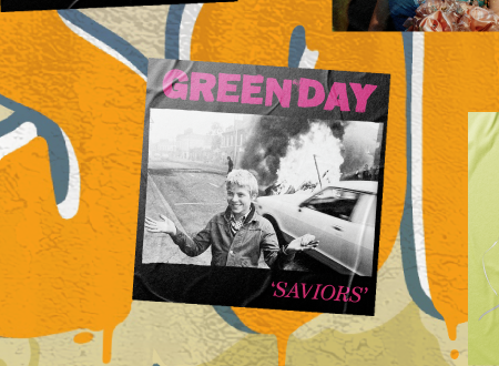 Album art cover for Green Day's Saviors plastered on a beach wall.