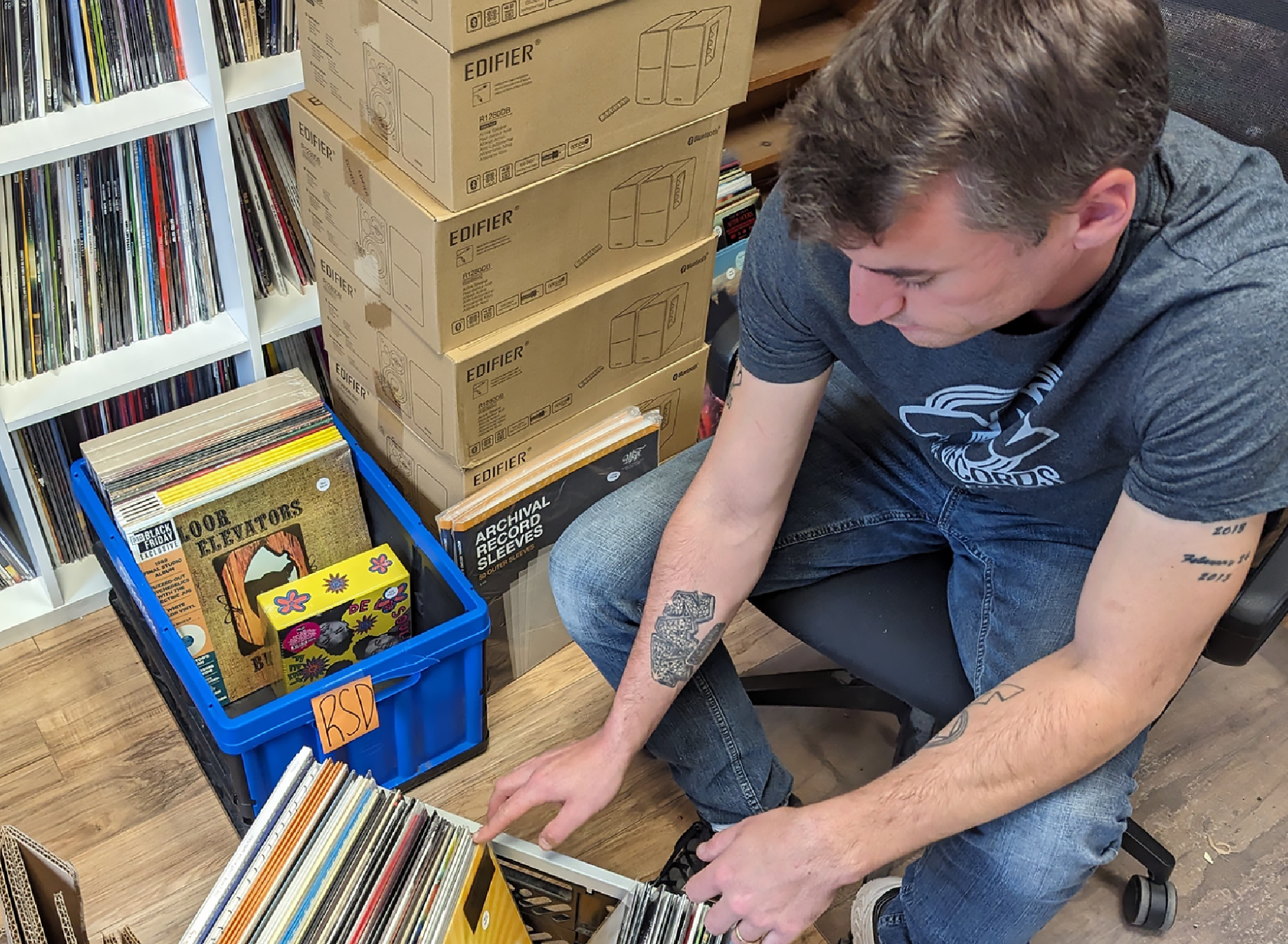 Jimmy Donnelly, owner of Taz Records, flipping through vinyl records.