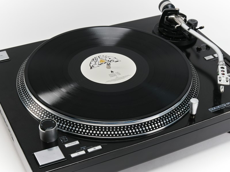 Angine de Poitrine Volume I black vinyl record on a turntable