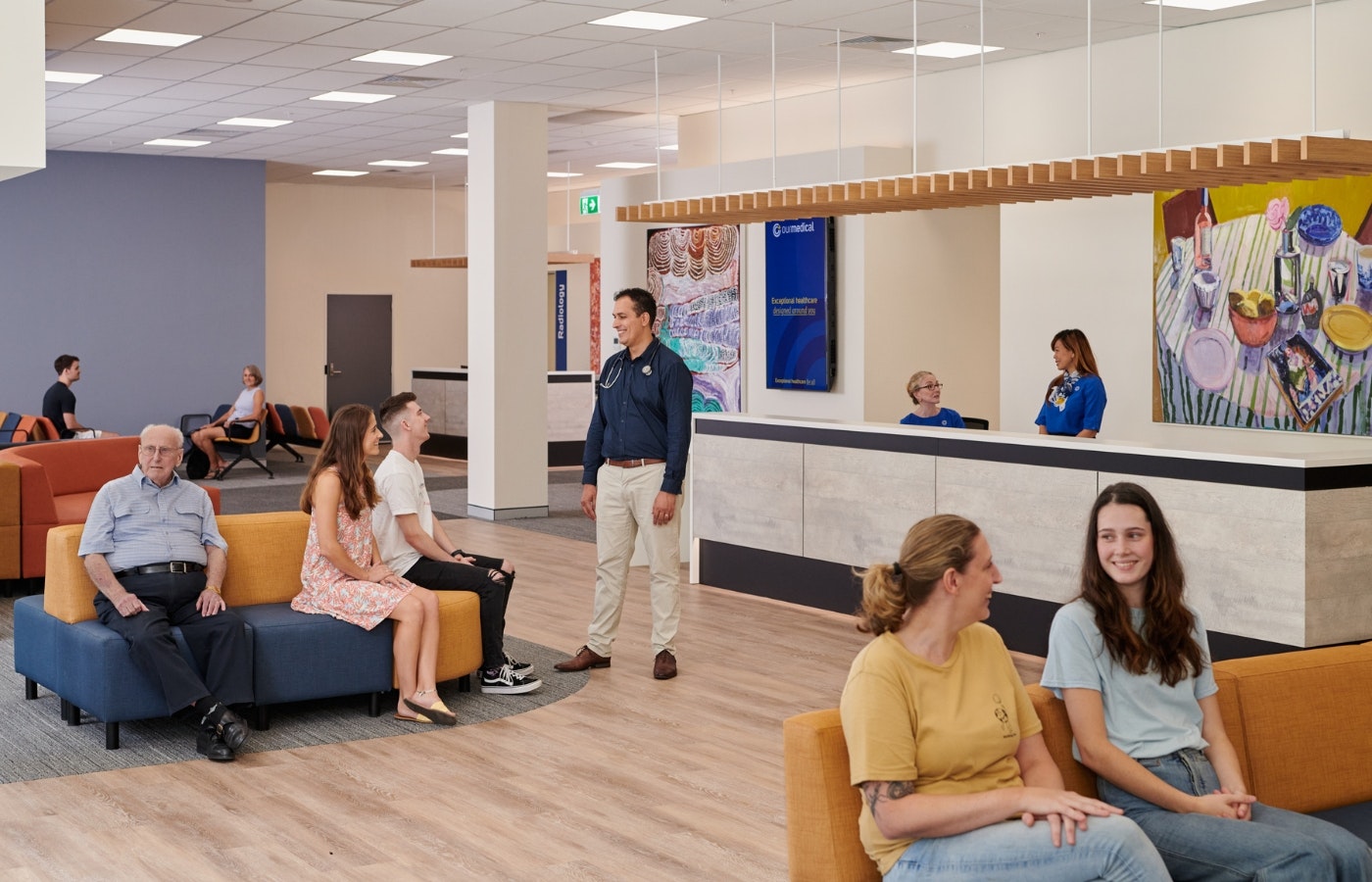 GP and patient in waiting room