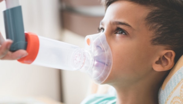 Child receiving asthma treatment