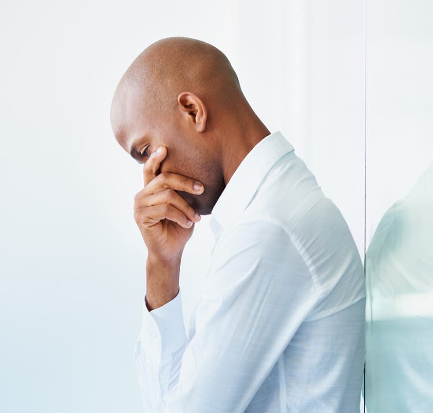 Man with hand on chin