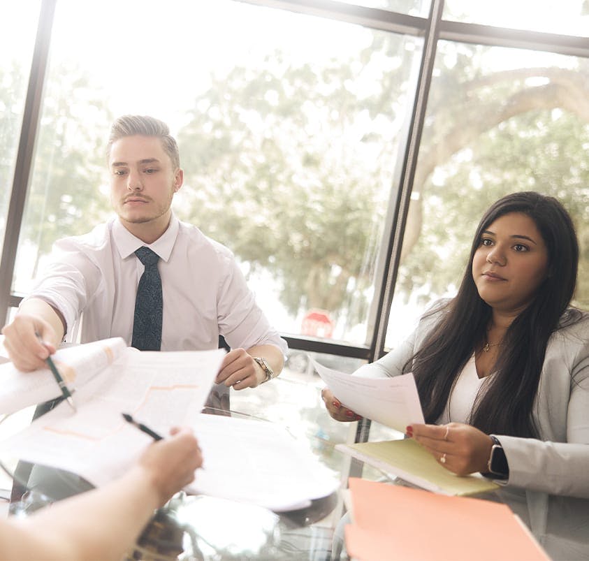 lawyers and client at table