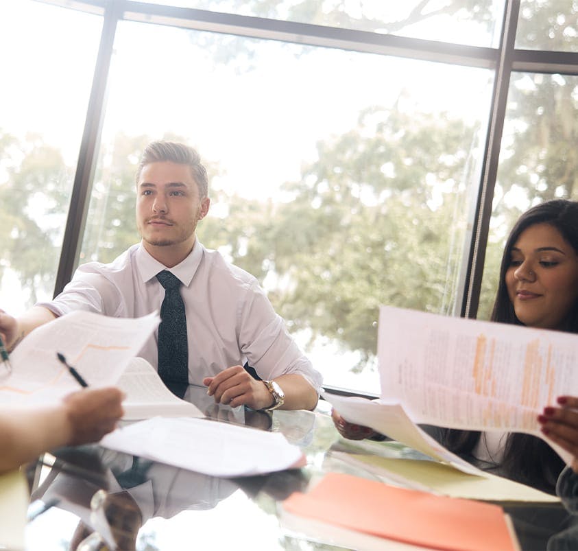 lawyers and client at table