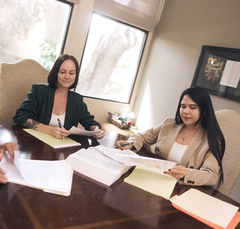 two women looking at paperwork