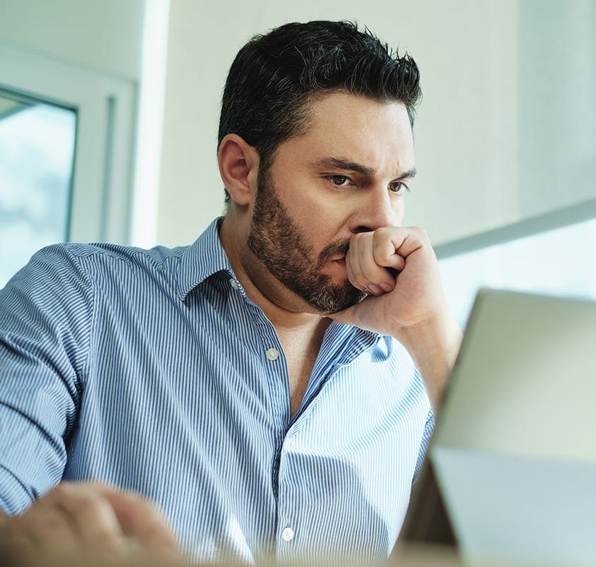 man looking at an ipad