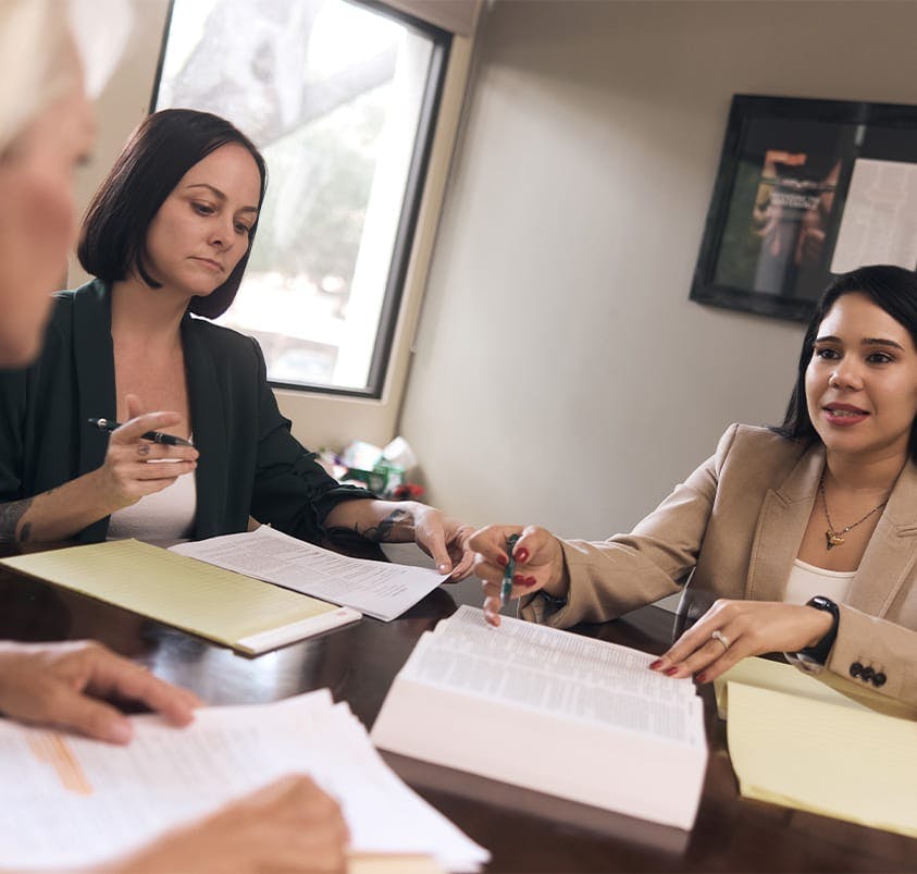 attorneys looking at a book