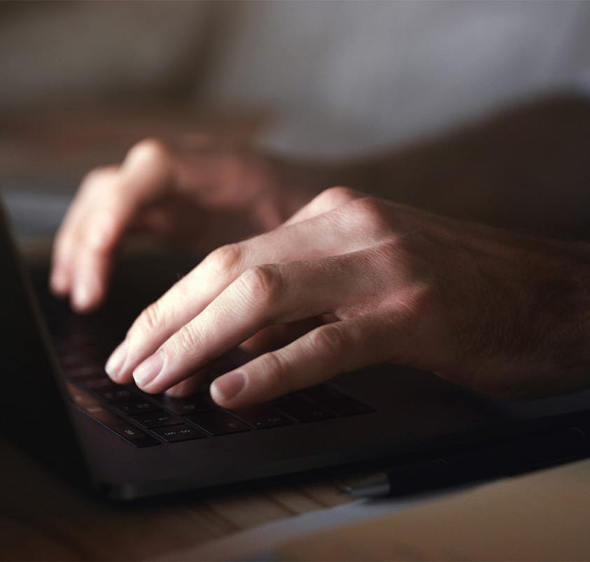 person typing on a computer
