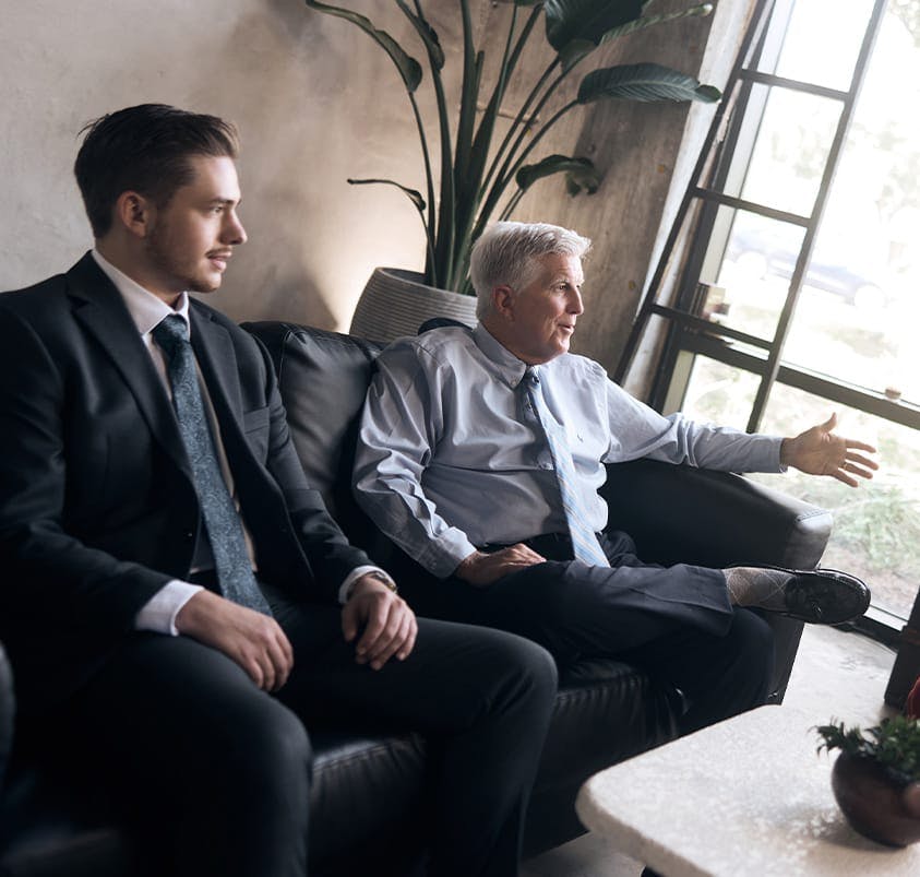 two attorneys on a couch