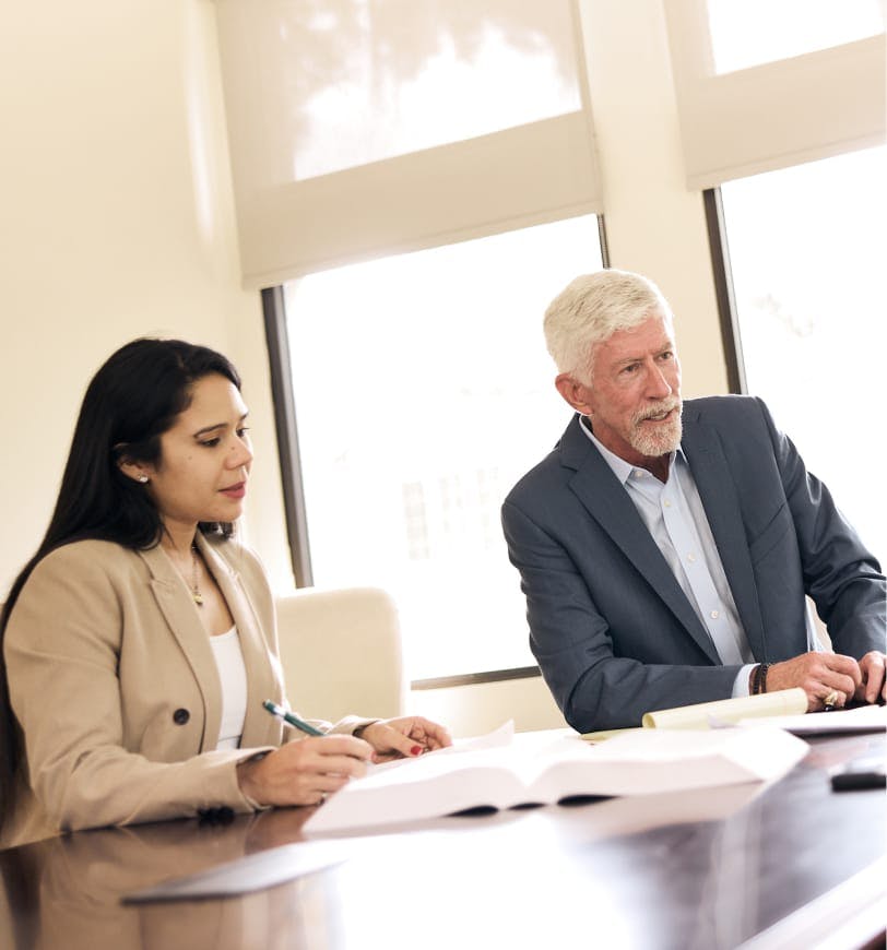 two people looking at documents