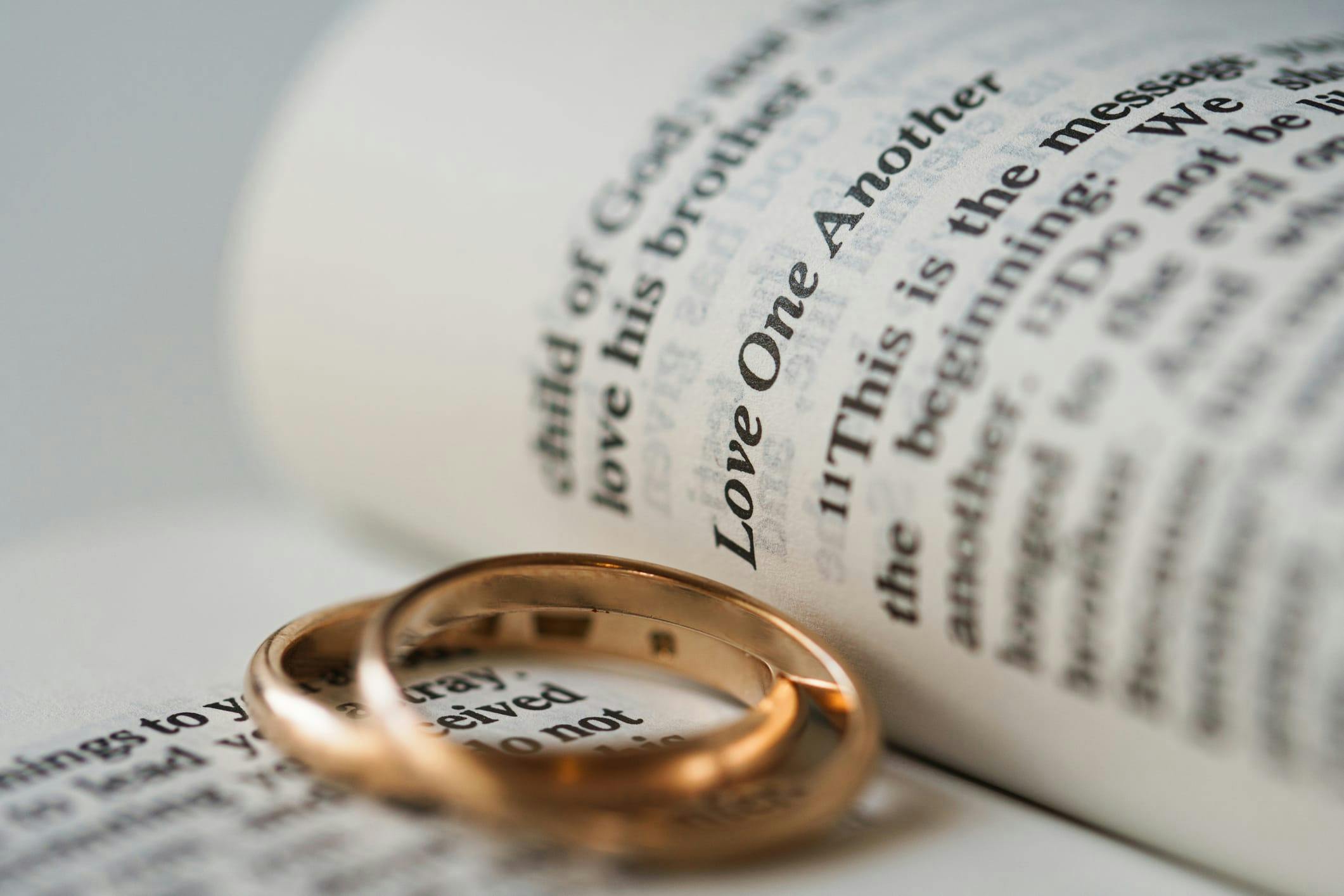 two rings on an open book