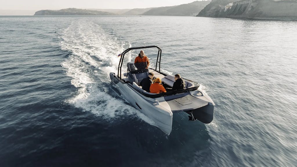 Passengers riding the Korkyra 650 catamaran power boat during a winter trip.