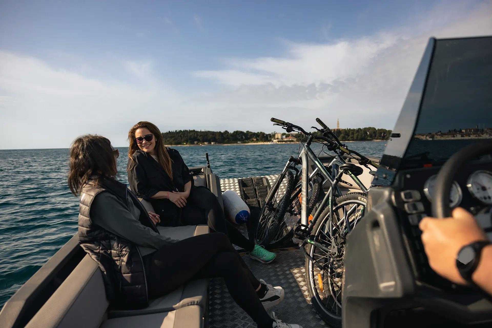 Two cyclists enjoying the ride on the Korkyra 650 Pro rotomolded boat