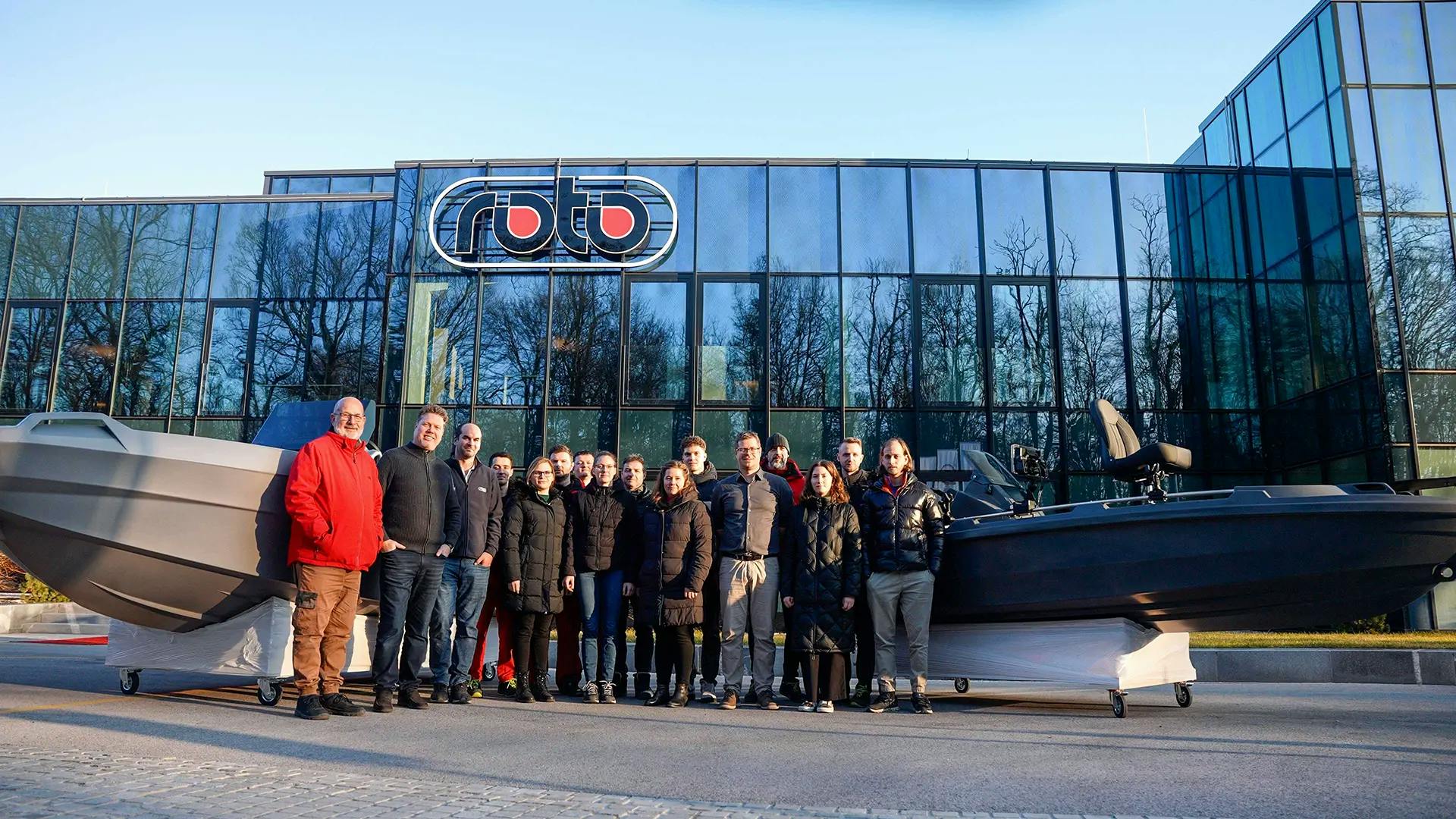 Team in front of the company
