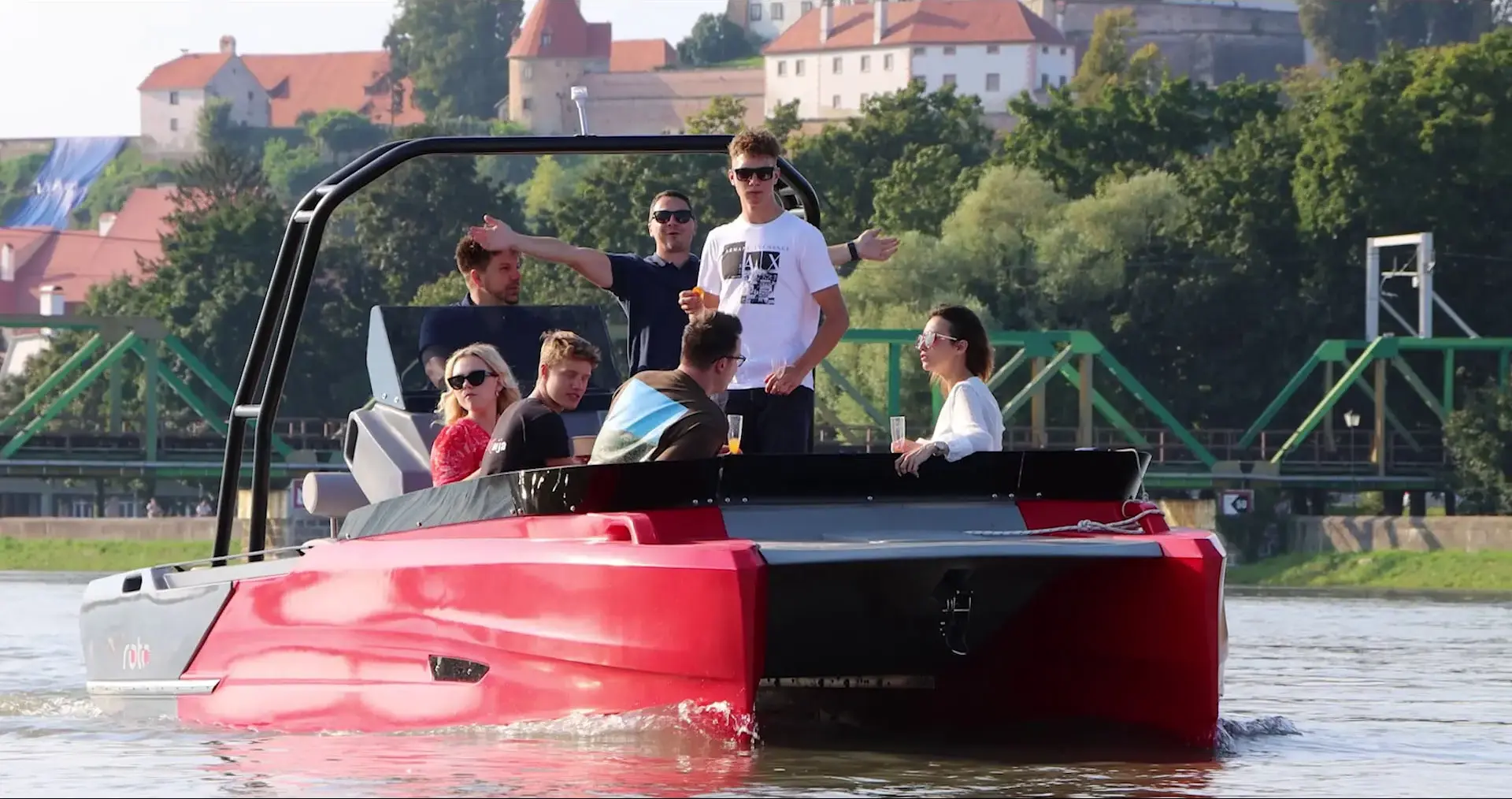 A group of young adults celebrating birthday on a party boat.