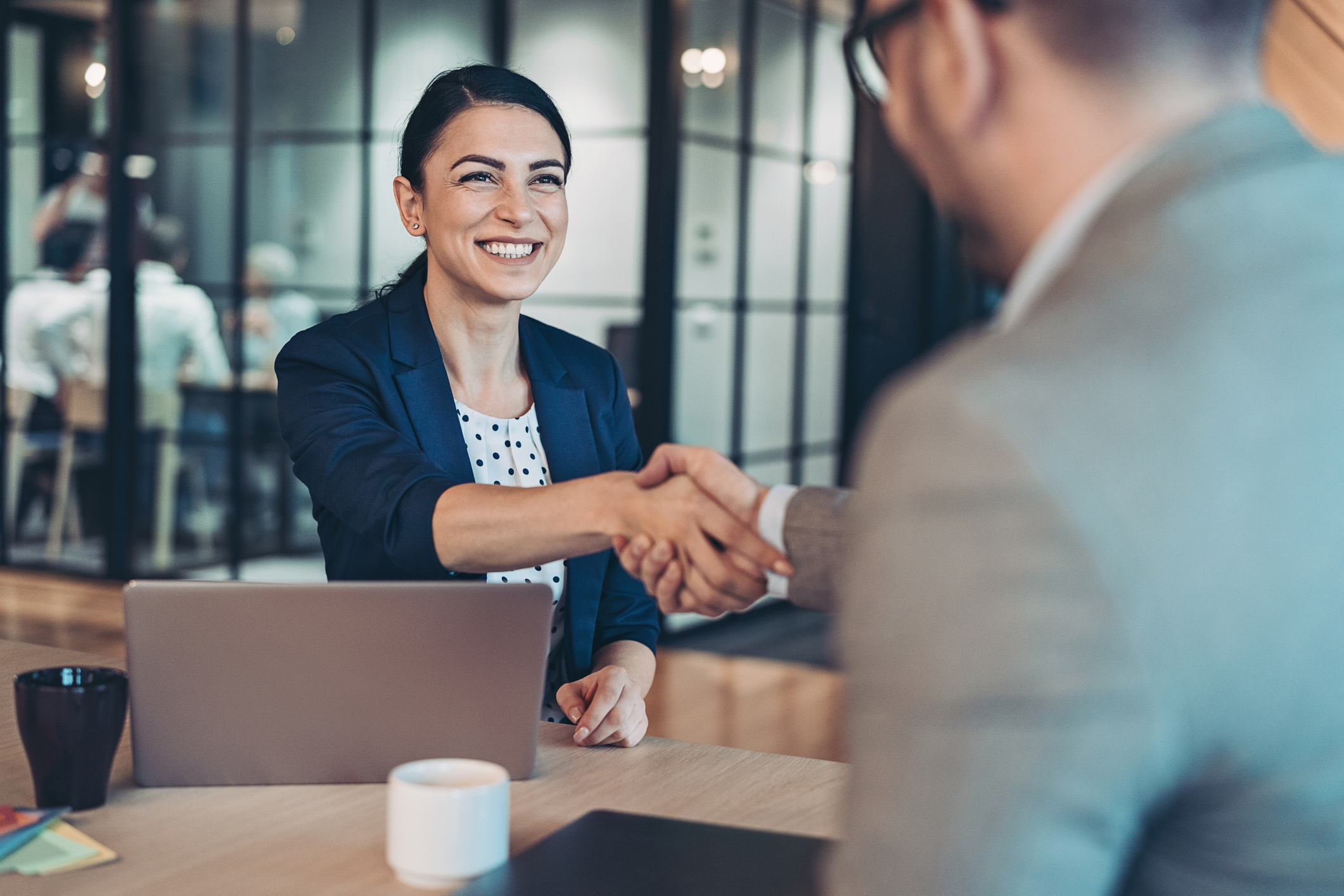 woman and man shake hands after successful service integration
