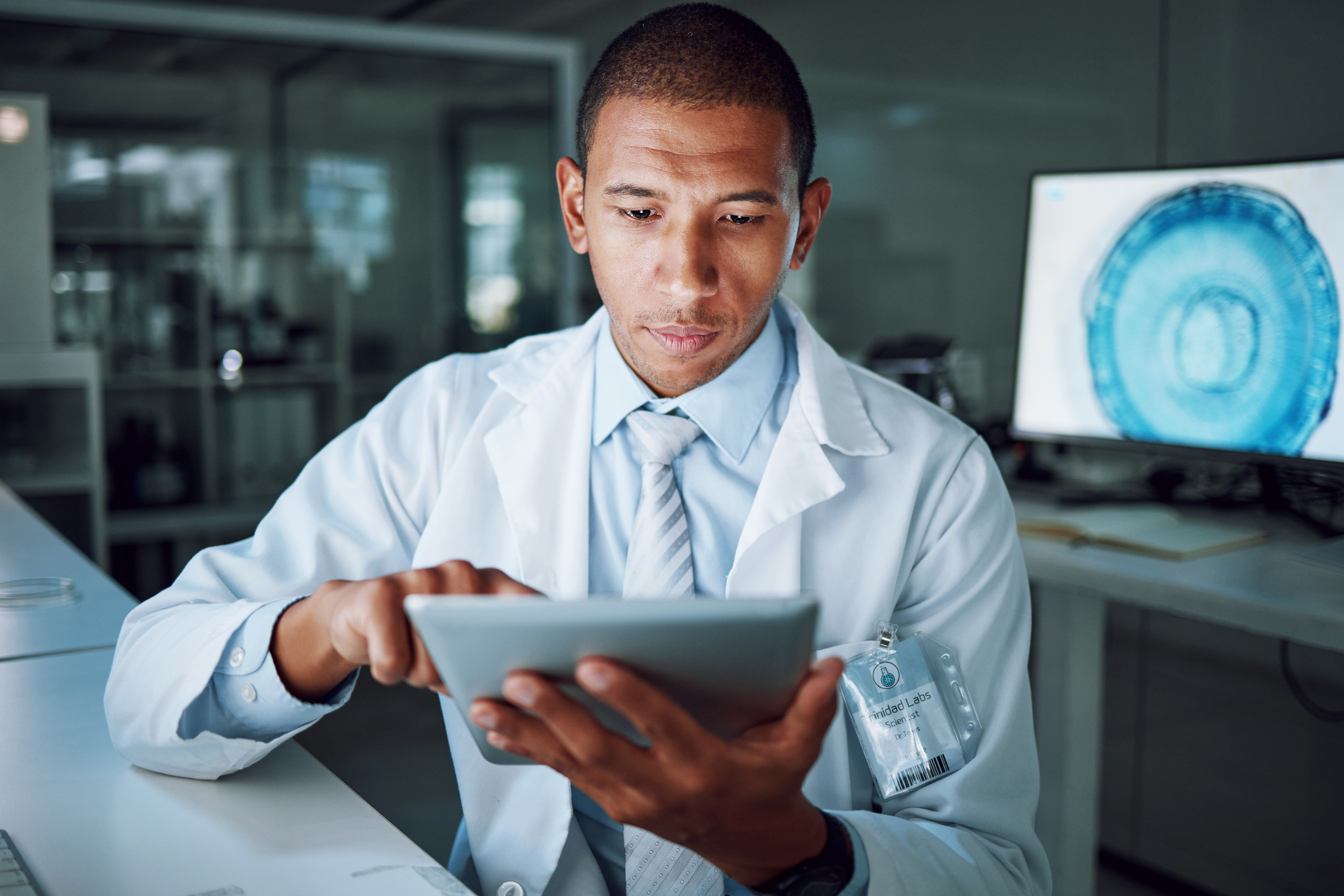 doctor working on a tablet with a fully managed technology solution