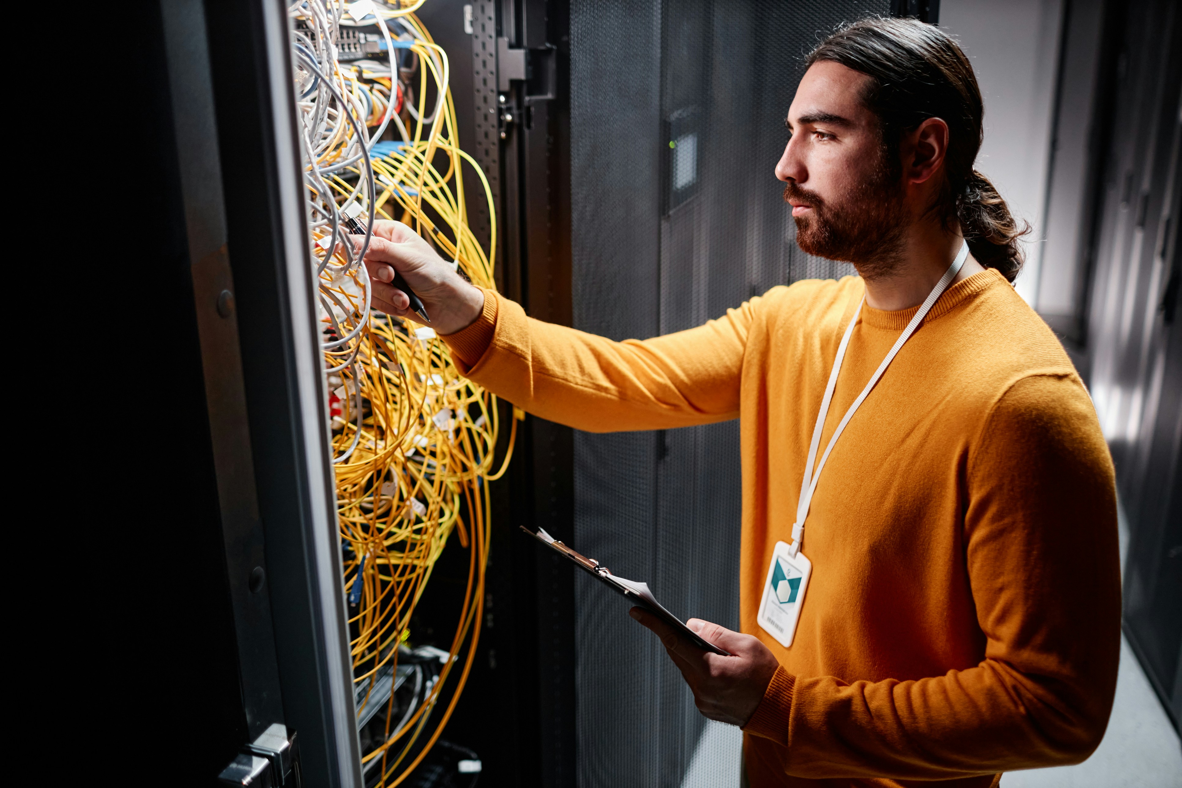 a technician fixing server infrastructure