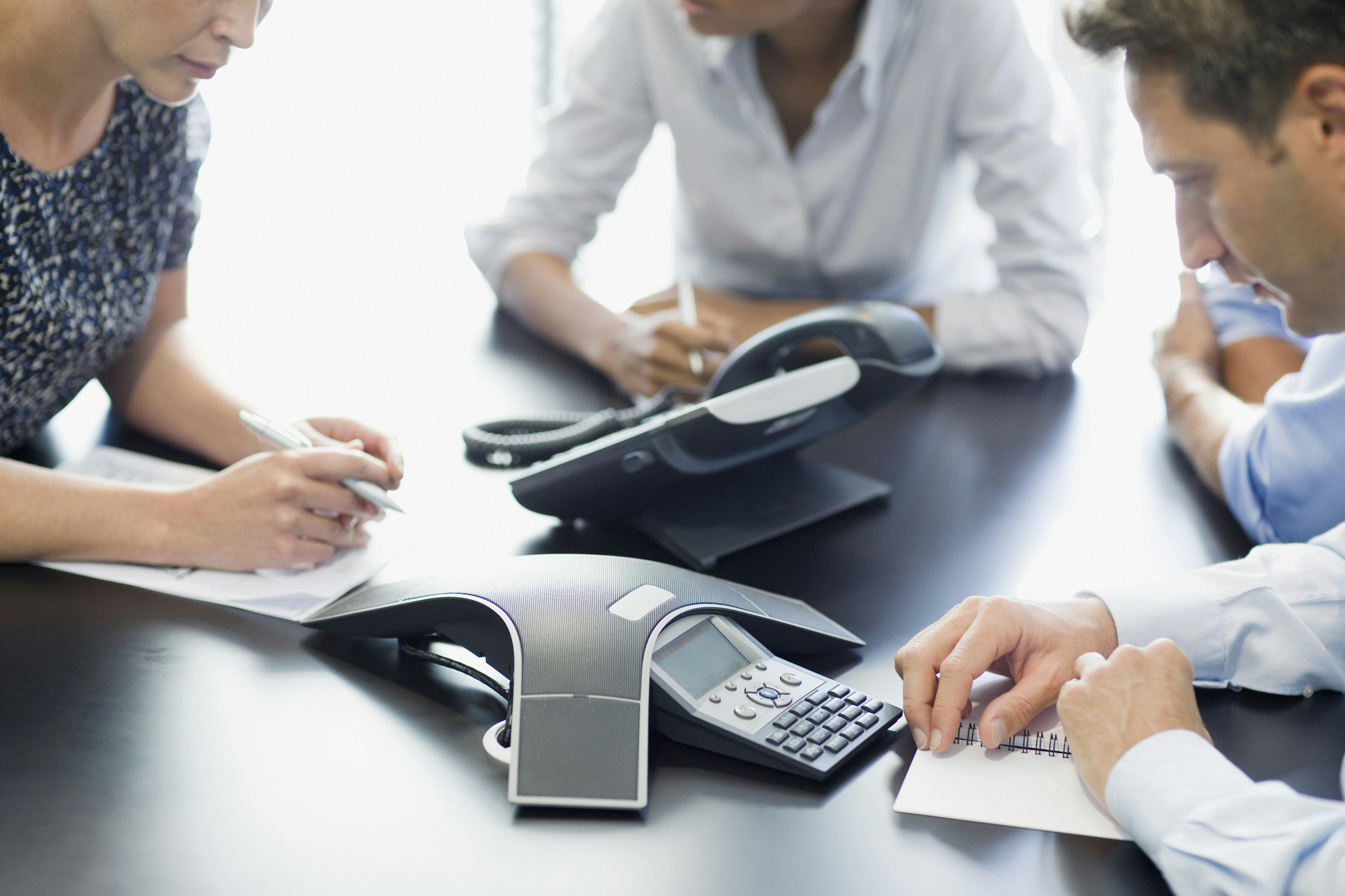 A team having a conference call with voip system