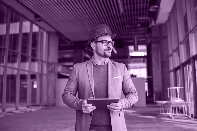 Project Manager at a Construction Company Holding a Tablet