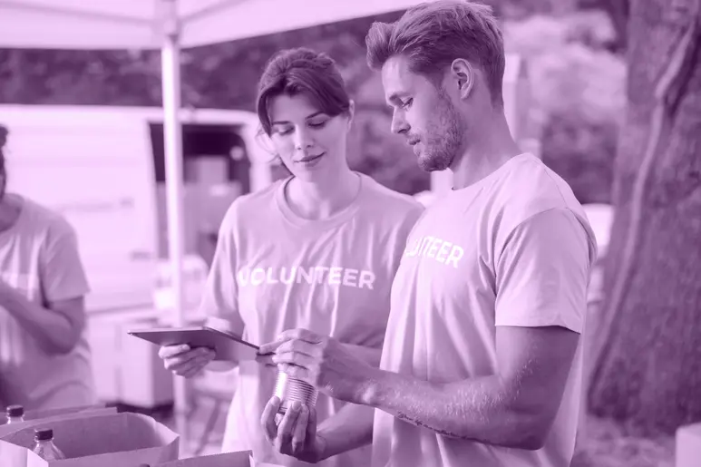 Volunteers for a Nonprofit Working on a Tablet