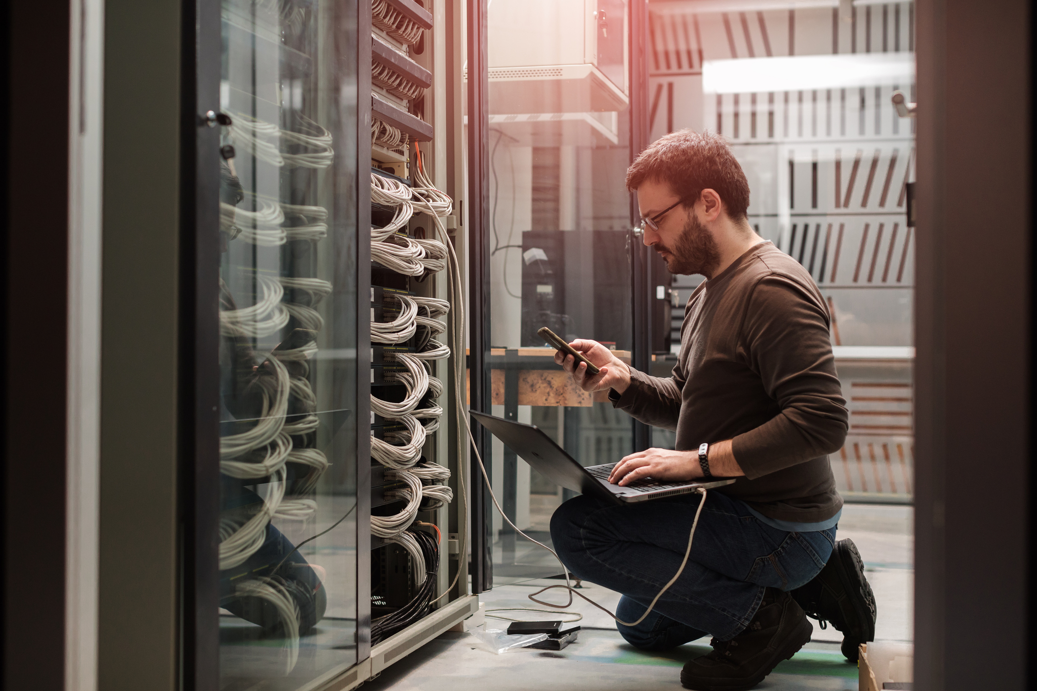 Technician Working on Business's Cloud Services in Server Room