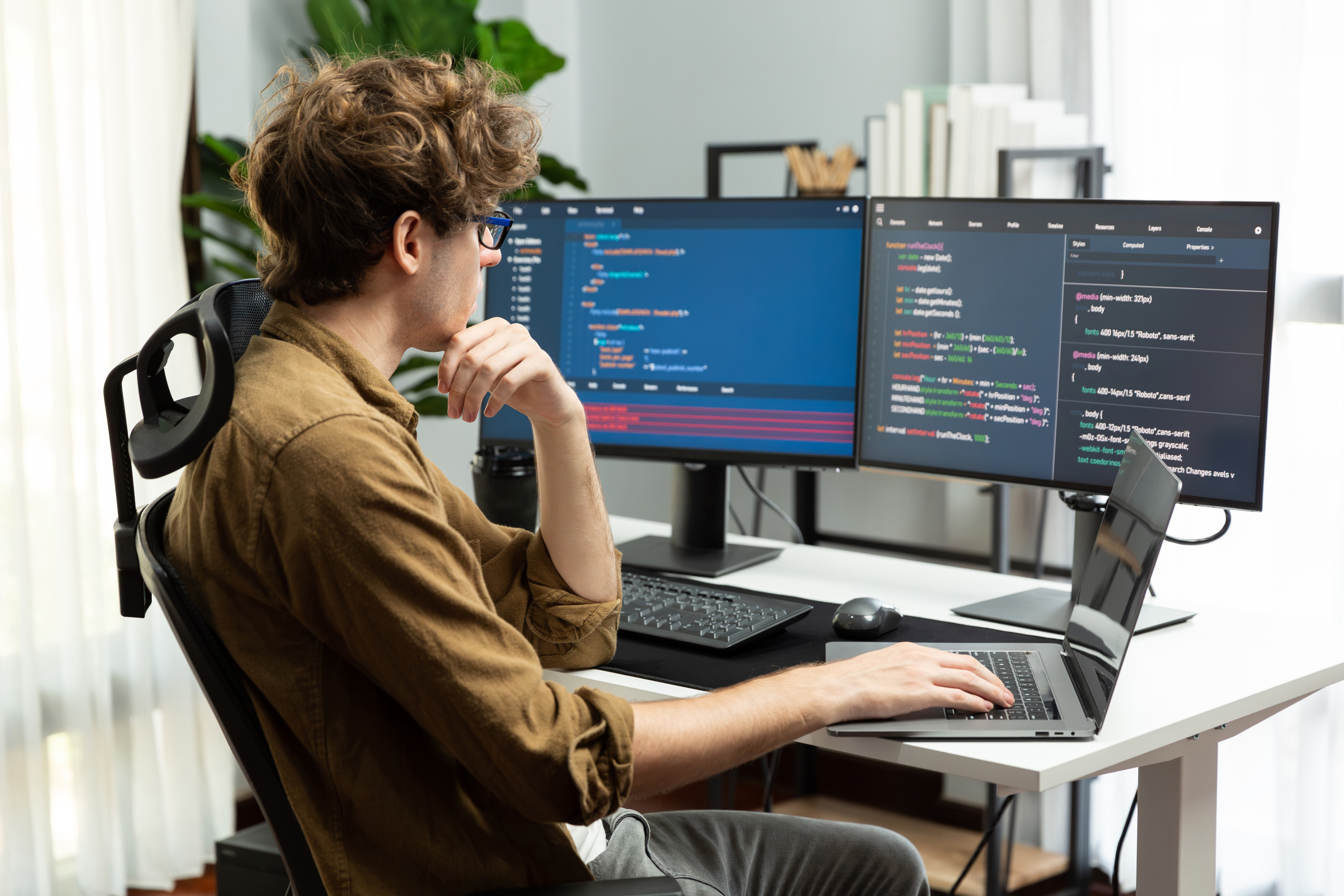 IT Technician Monitoring Systems and Reviewing Logs