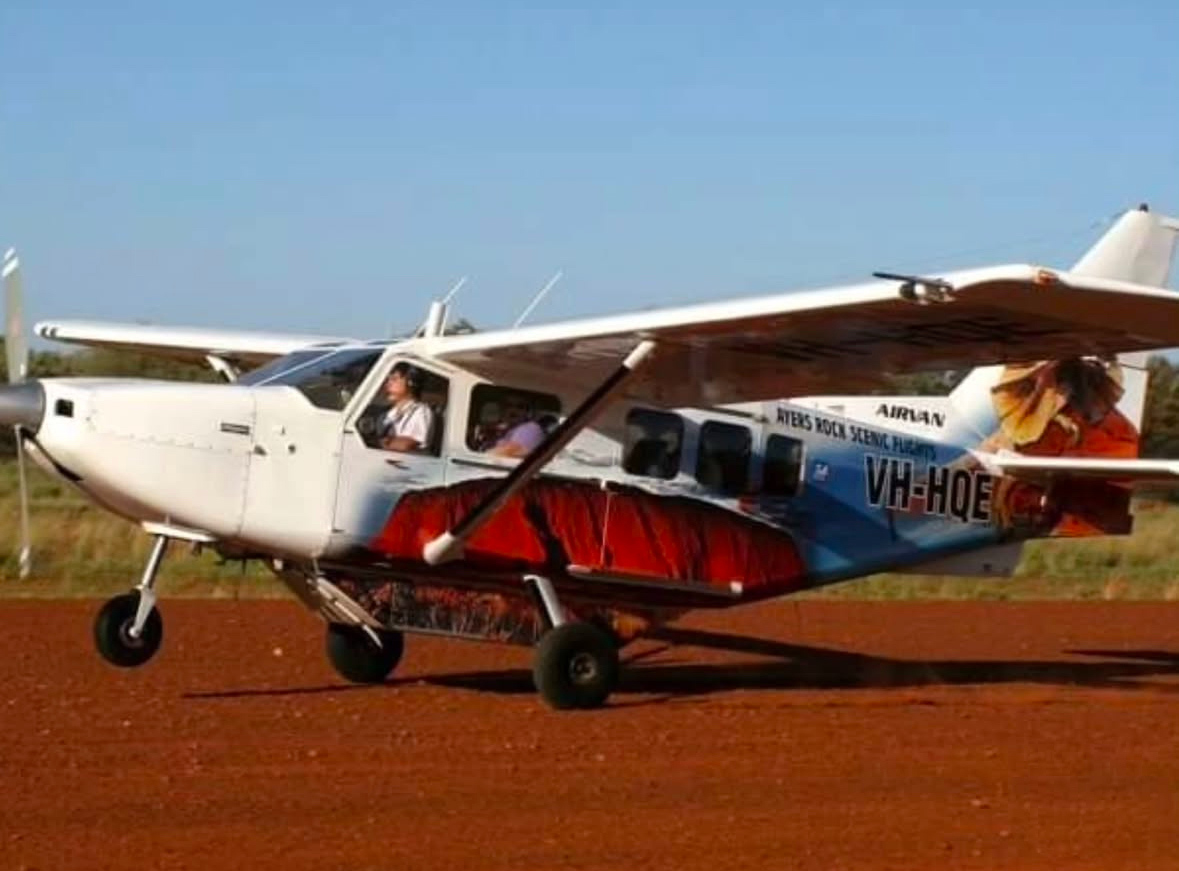 small plane on a dirt runway