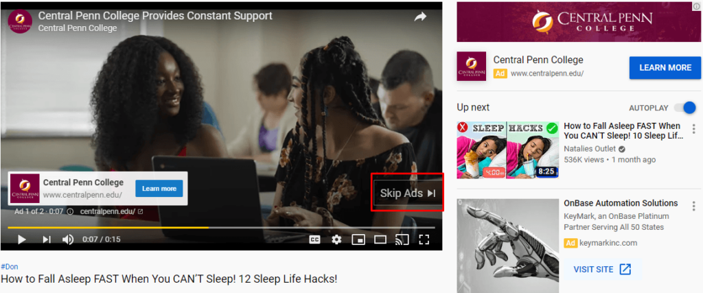 YouTube video ad from Central Penn College showing a young woman talking in a classroom with classmates. The ad includes a banner that says ‘Central Penn College Provides Constant Support’ with a ‘Learn More’ button, and the 'Skip Ads' button is highlighted. On the right sidebar, there's a Central Penn College channel listing, an autoplaying recommended video titled ‘How to Fall Asleep FAST When You CAN’T Sleep!’, and another ad for OnBase Automation Solutions.