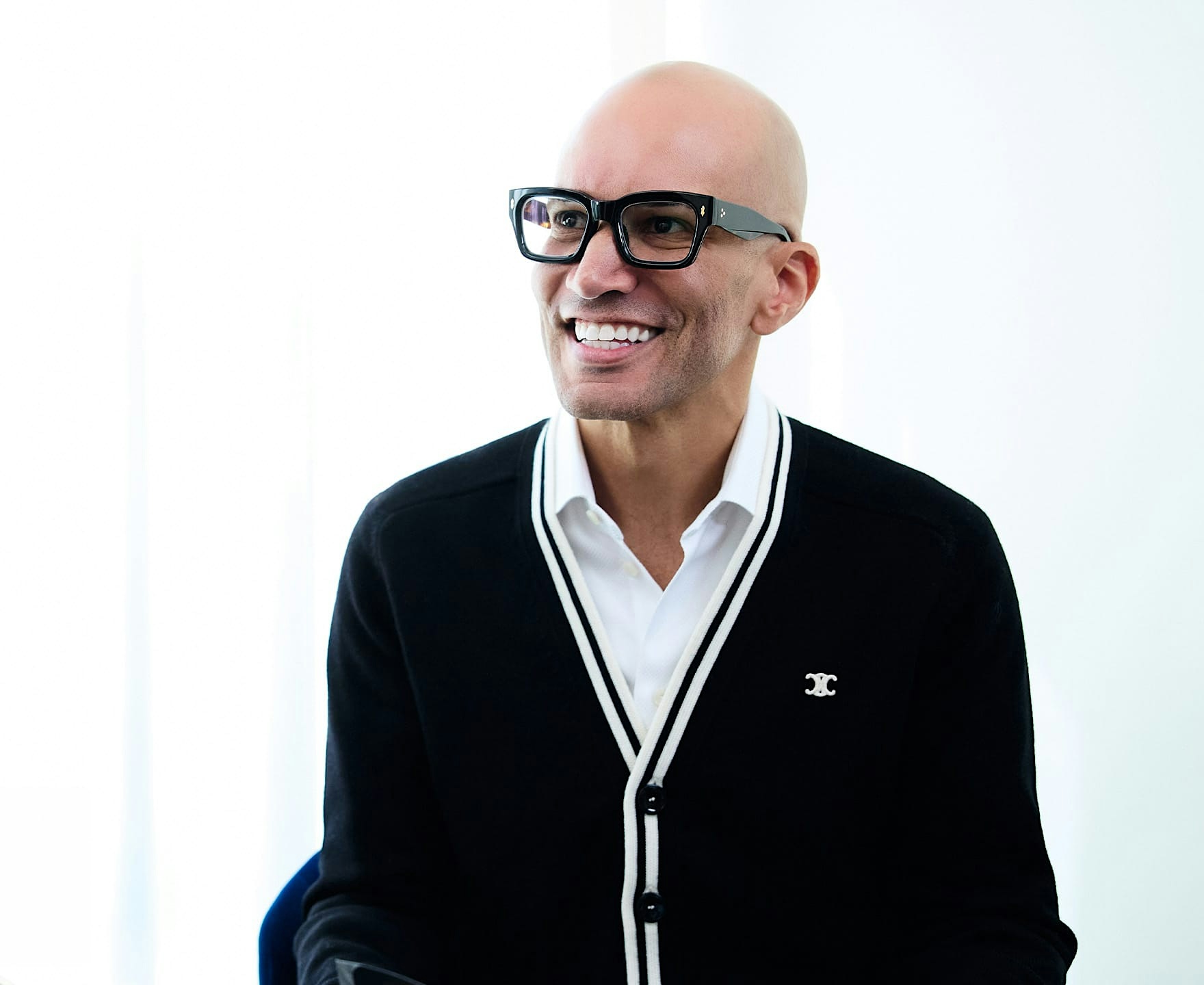man in glasses smiling