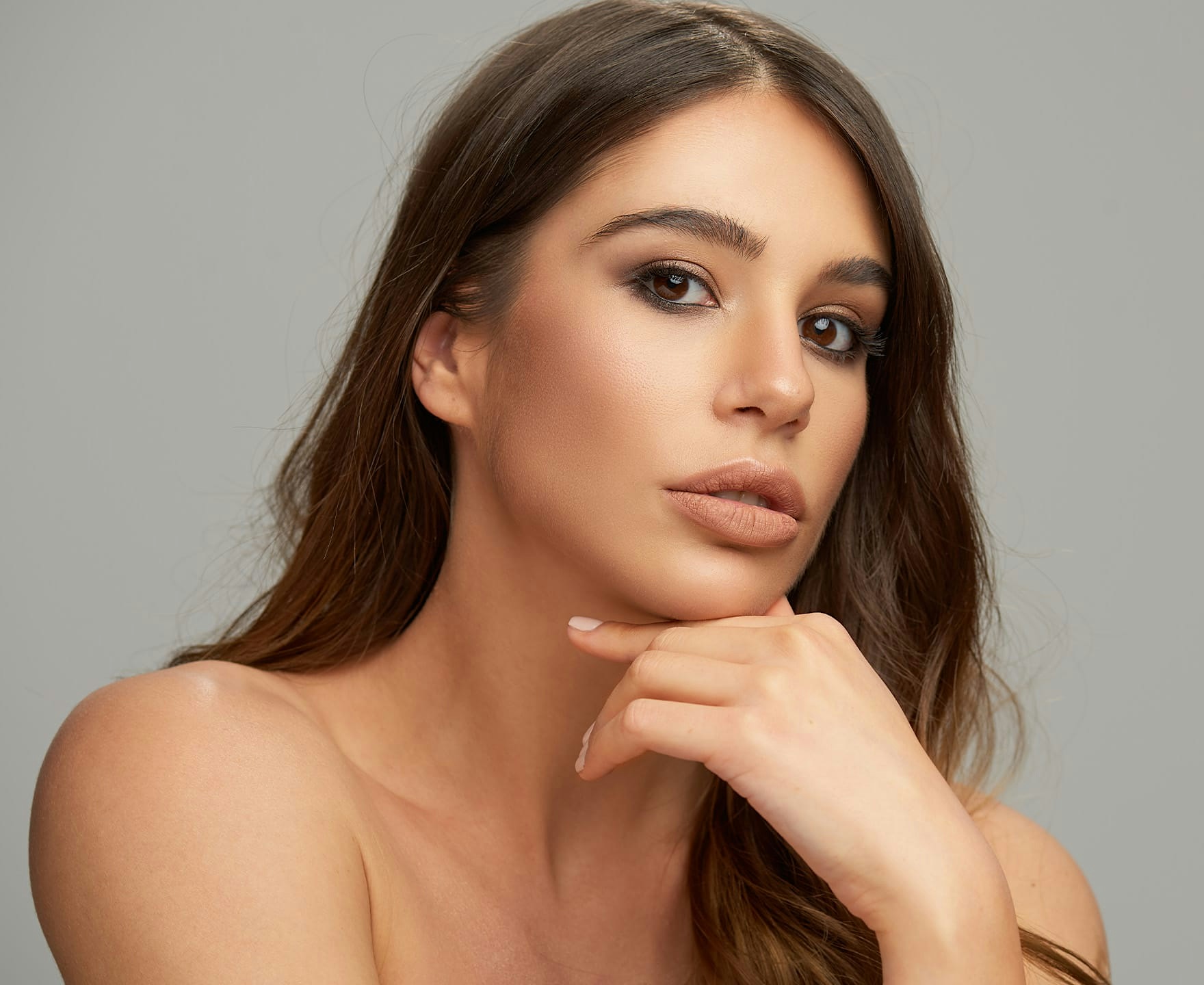 woman resting chin on hand