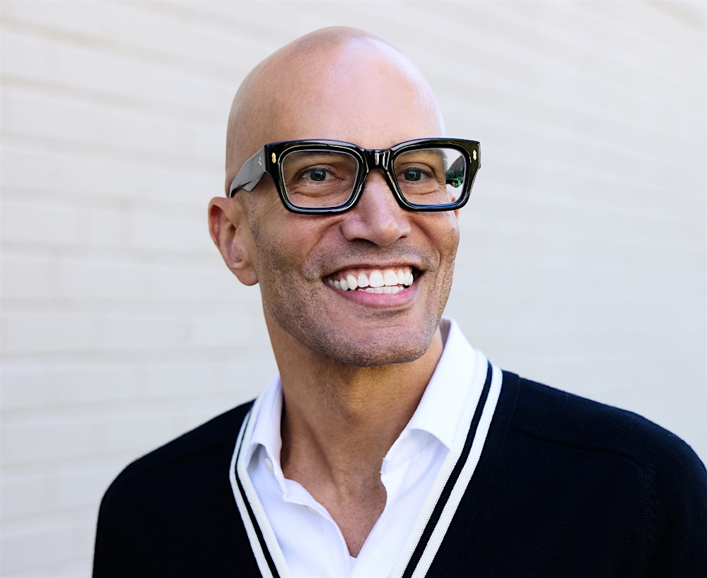 man in glasses smiling