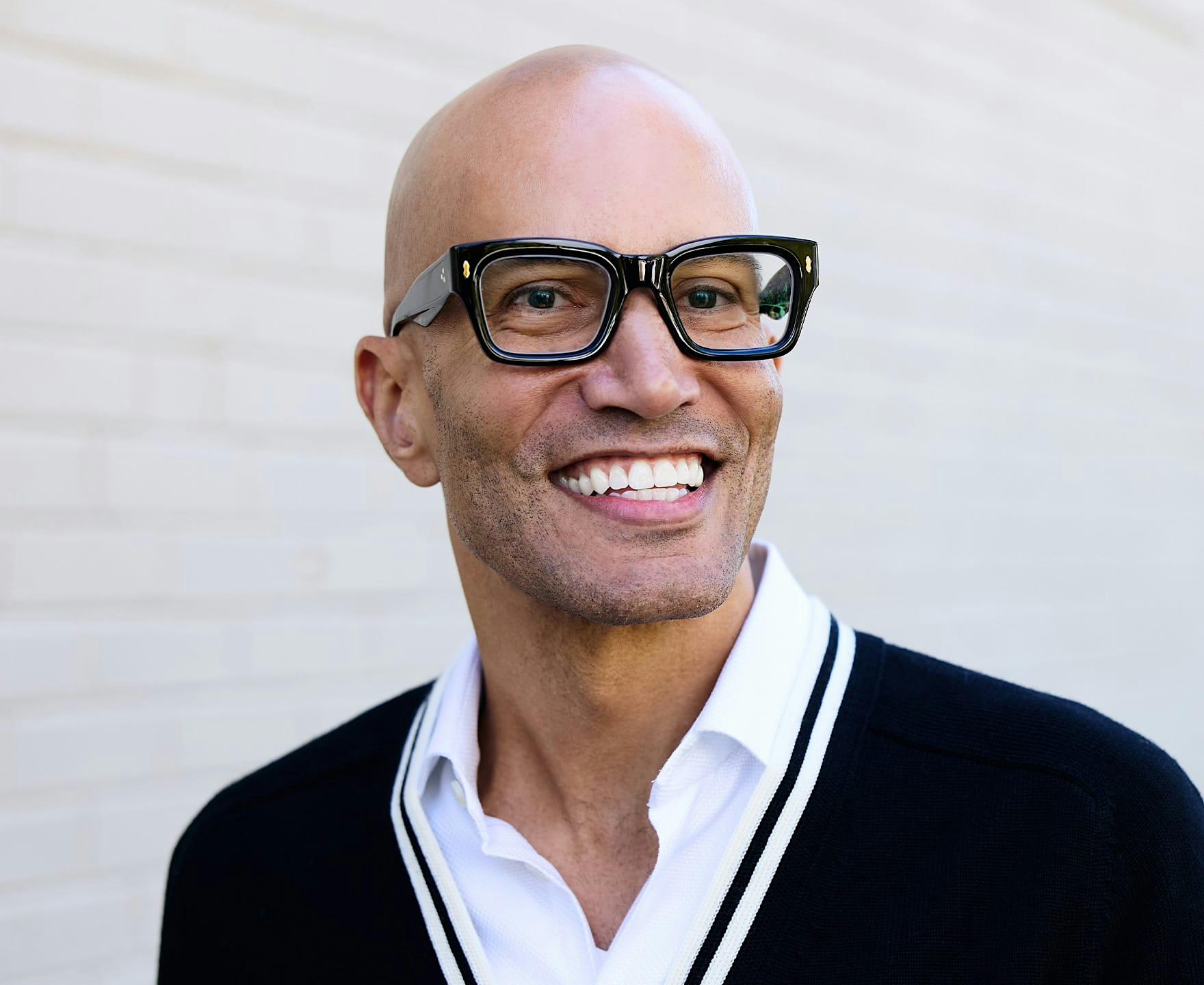 man in glasses smiling