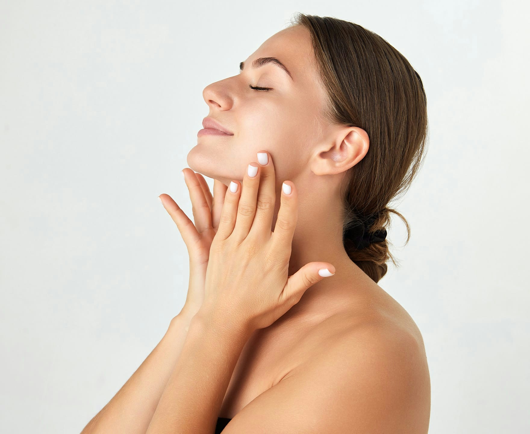 woman posing with hands on neck