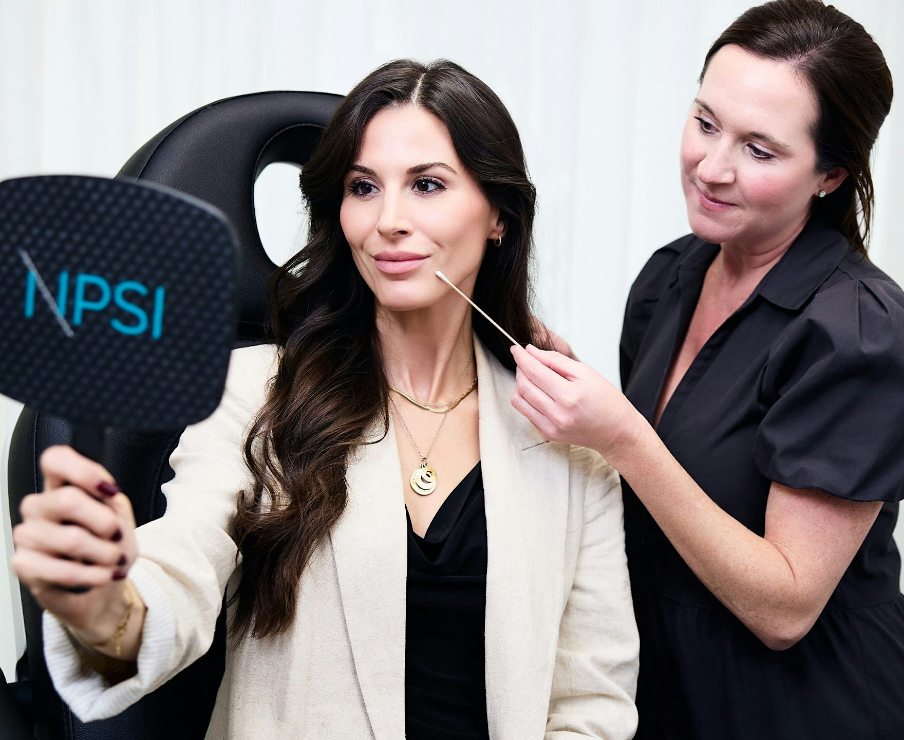 woman receiving facial exam