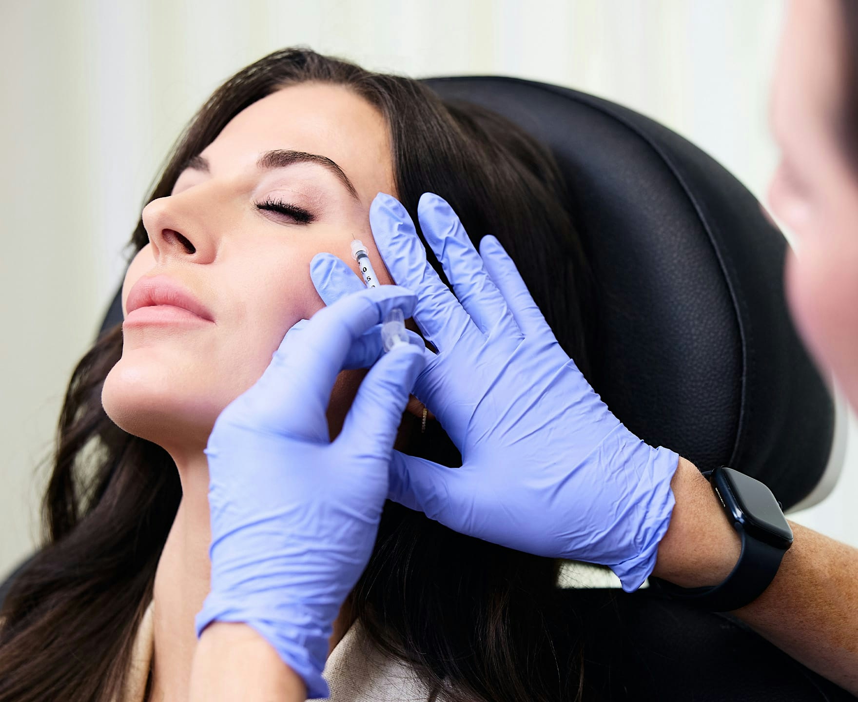 Woman receiving facial injection